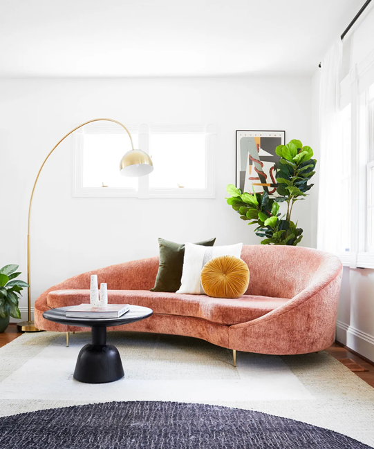 how-to-design-a-modern-living-room-with-a-curved-sofa-and-a-geometric-area-rug-and-arc-modern-floor-lamp