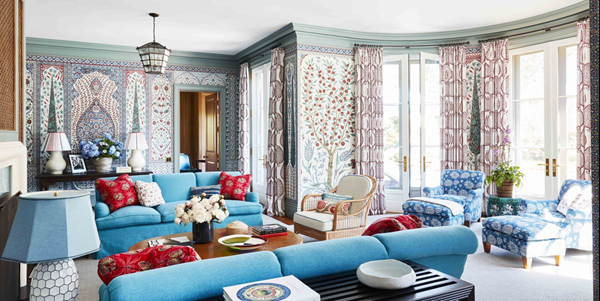 bright-maximalist-living-room-with-blue-furniture-and-vibrant-wallpaper