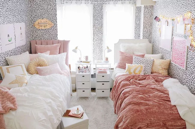 a-dorm-room-with-double-twin-bed-and-dot-patterned-wall-paper