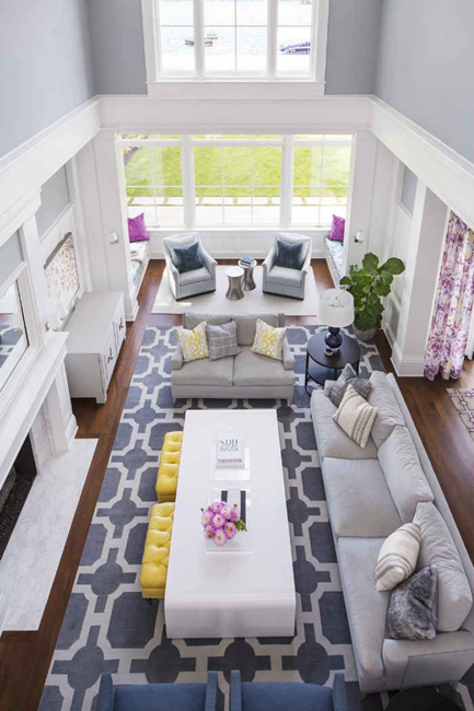 all-white-long-living-room-layout-with-white-geometrical-grey-area-rug-and-high-ceilings
