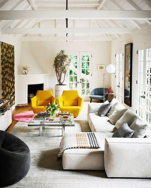 long-living-room-layout-with-two-arm-yellow-chair-and-grey-area-rug