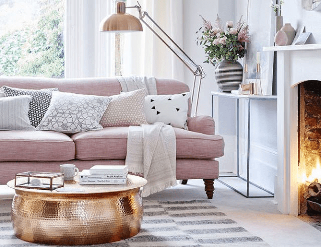 Best-Tips-to-Stage-Your-Home-to-Sell-Faster-pink-sofa-gold-copper-coffee-table-living-room