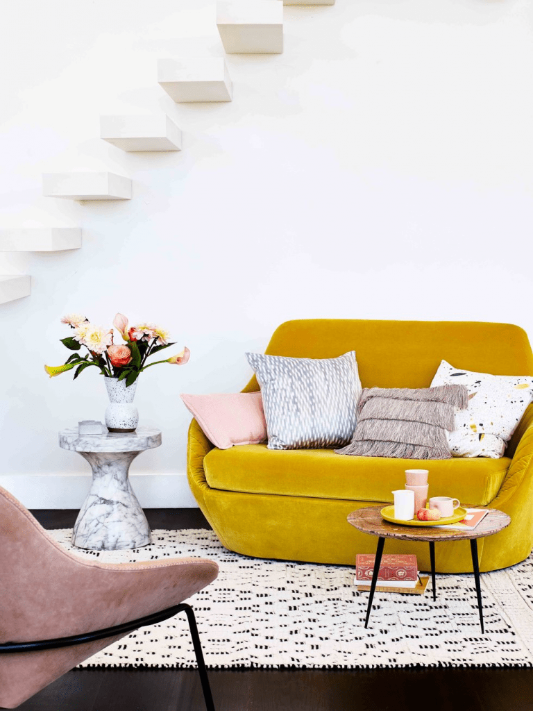 Best-Tips-to-Stage-Your-Home-to-Sell-Faster-yellow-sofa-pink-armchair-living-room