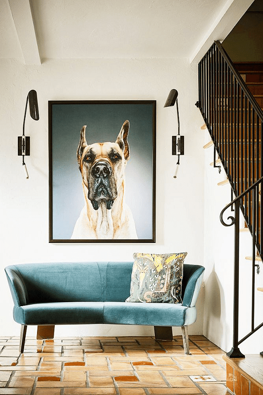 modern-foyer-with-blue-sofa-and-oversize-artwork-and-3-layers-of-lighting