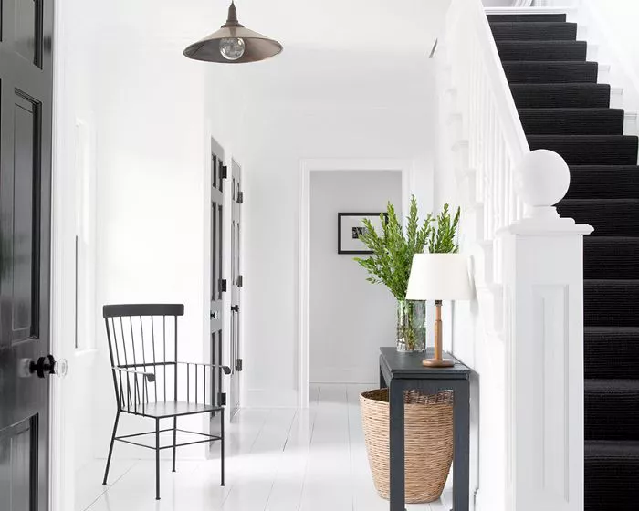 minimalist-feng-shui-foyer-entry-way-with-metal-chair-and-console-table