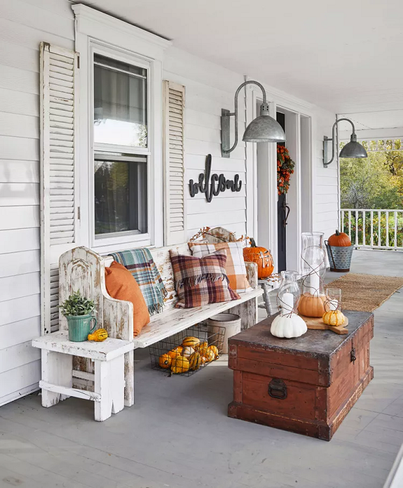 Front-Porch-Decor-with Faux-Leaves-Wreath-and-decorative-throw-pillows-and-pumpkin 