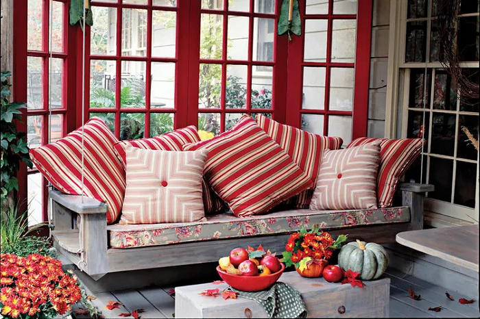 patio-fall-inspired-in-Burnt-Orange-Hues-throw-pillows-and-pumpkins