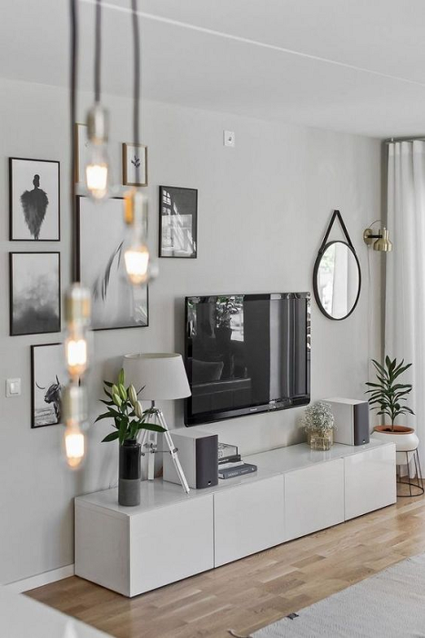 Scandinavian-living-room-with-TV-stand-and-plants-next-to-it