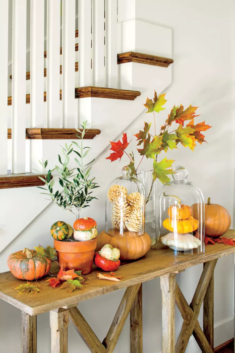 Rustic-fall-console-table-setting-with-pumpkins-and-candles