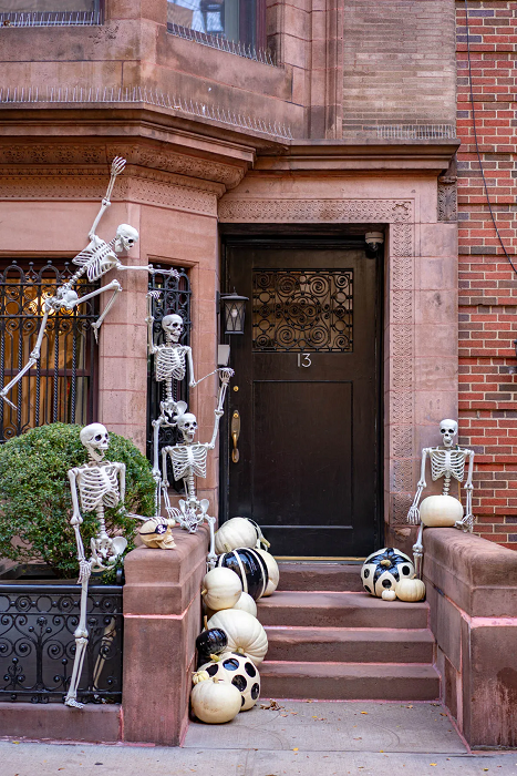 Spooky-Haunted-Porch-Decorations-Transform-Your-Entryway-for-Halloween-with-skeleton-and-pumkings