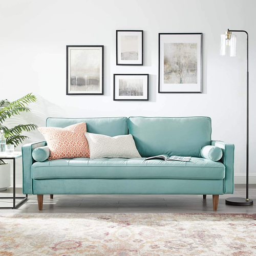 best-couches-that-make-a-room-look- bigger-in-a-to-consider-in-a-modern-living-room-with-a-mint-green-sofa