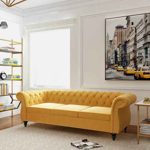 best-couches-that-make-a-room-look- bigger-in-a-modern-living-with-large-wall-art-and-bookshelvees-and-light-yellow-couch