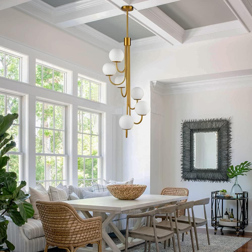 contemporary-dining-room-with-a-modern-gold-chandelier-as-a-statement-pieces