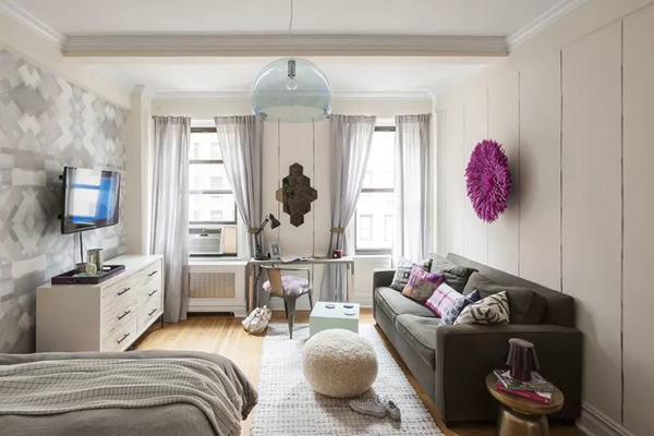 studio-apartment-ideas-with-colorful-walls-patterned-rug-and-textured-throw-pillows