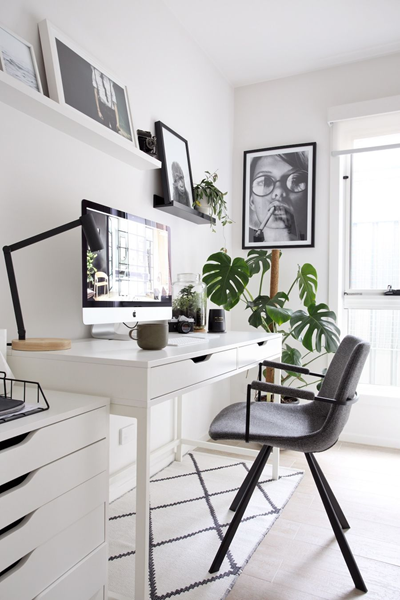 a-decorated-desk-with-lots-of-natural-light