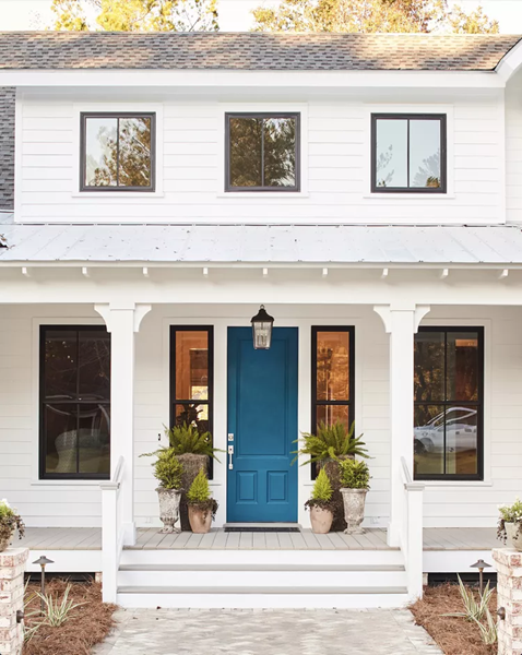white-exterior-home-with-a-navy-blue-front-door