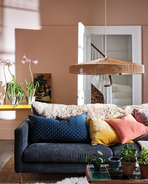Things-Designers-Notice-When-Visiting-a-Home-is-the-furniture-arrangement-in-living-room-with-pink-walls