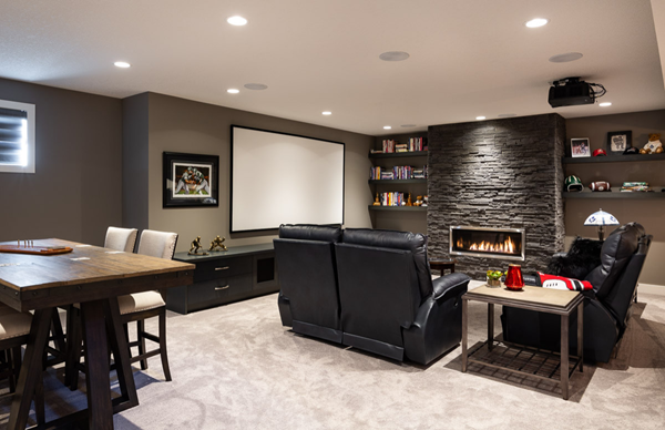 man-cave-with-a sports-theme-There-is -a-large-TV-on-the-wall-a-pool-table-and-a-bar.
