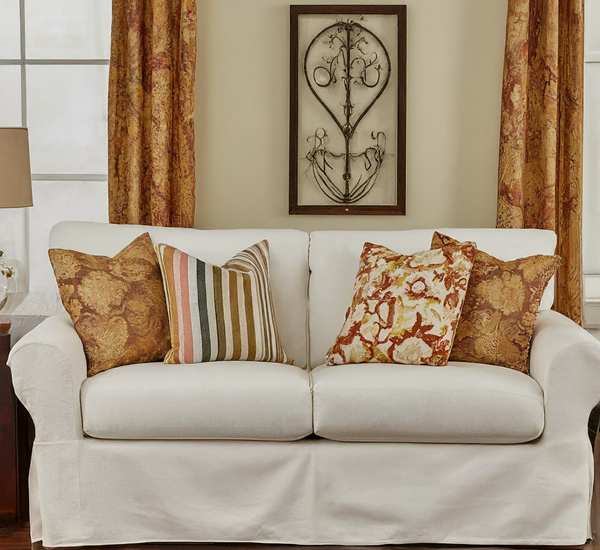 how-to-style-a-slipcover-couch-with-throw-pillows-complementing-window-curtains