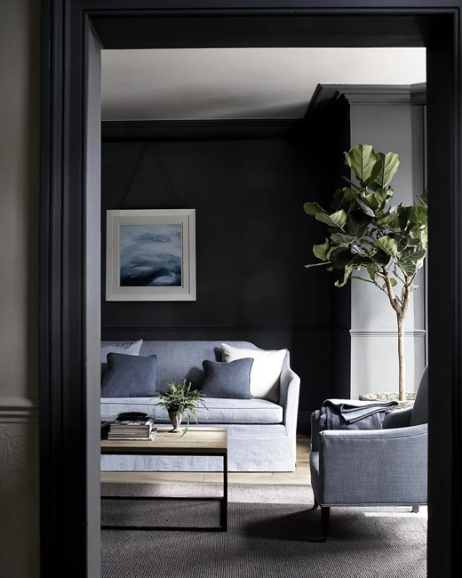 how-to-design-a-modern-living-room-with-dark-wall-colors-and-grey-sofa-and-arm-chair