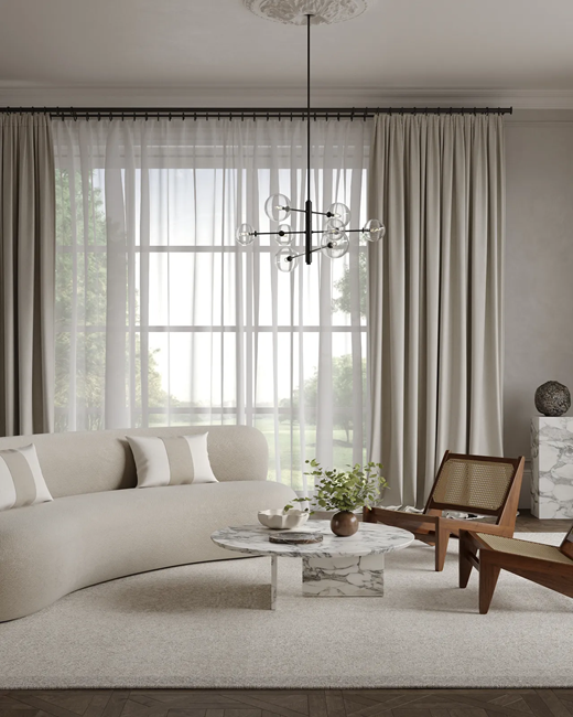 Eco-Conscious-Japandi-living-room-with-curved-sofa and-kangaroo-chairs-with-blackout-curtains