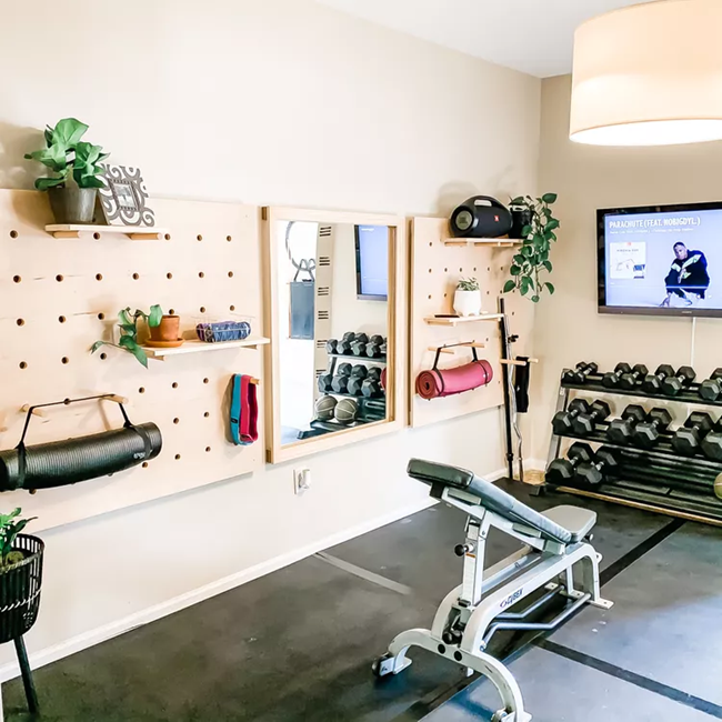 Small-Home-Gym-with-peg-boards-for-storage