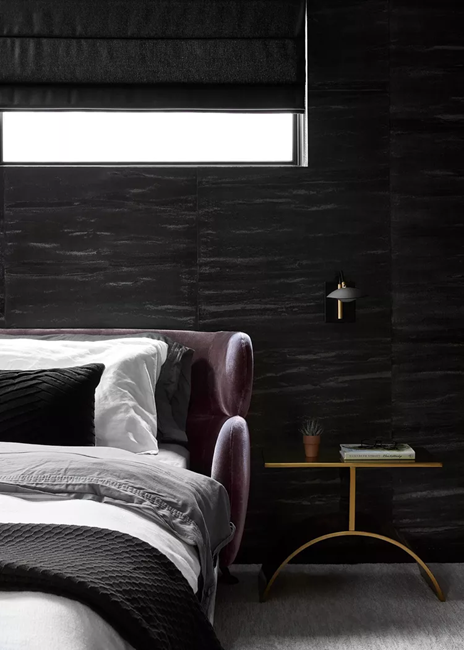 feminine-dark-bedroom-with-purple-curved-headboard