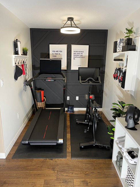 small-Peloton-gym-room-with-accent-black-wall