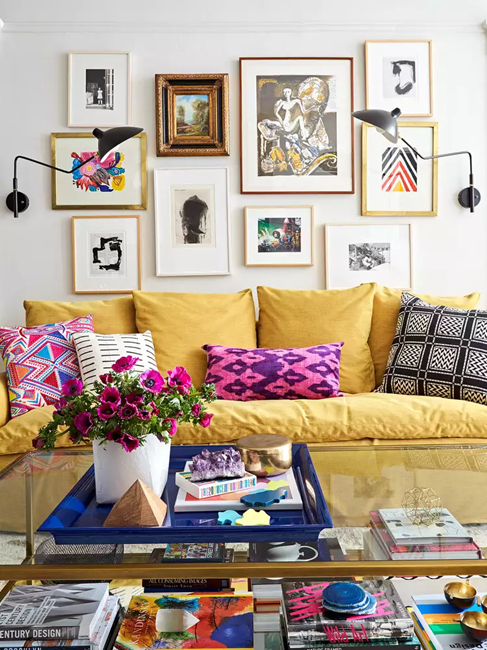 cozy-whimsical-maximalism-living-room-with-bright-yellow-couch--decor-accents-and-gallery-wall