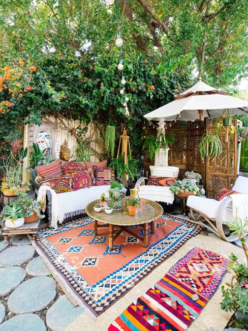 bohemian-patio-with-colorful-area-rugs-and-plants